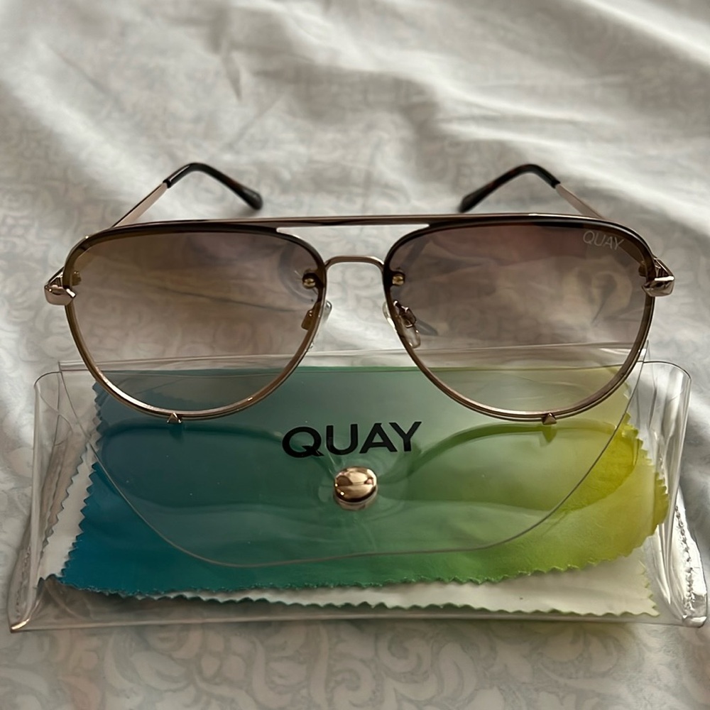 Quay sunglasses rimless gold frame with fade lenses. High key mini.